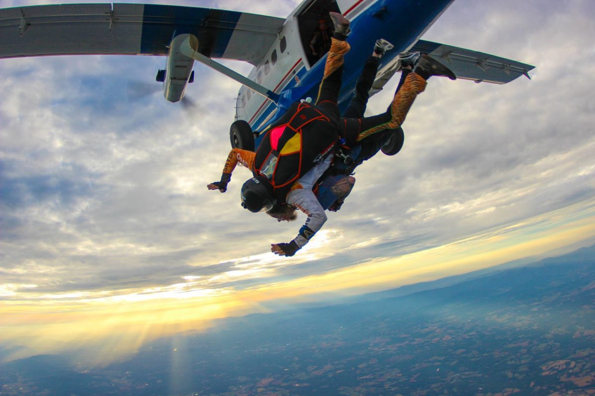 Exiting an airplane for a tandem skydive at 14,000 feet