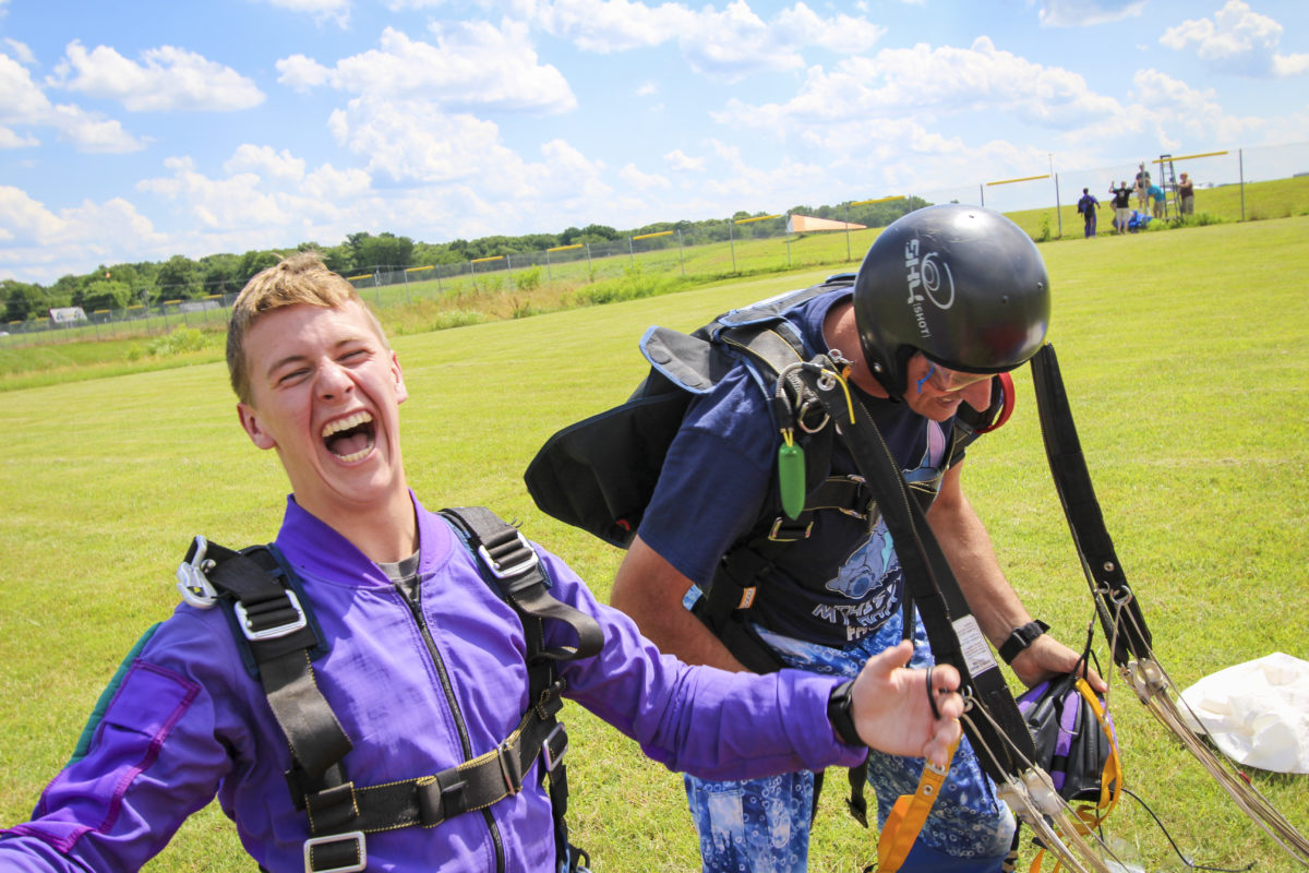 Pair of Skydivers Looking Extremely Happy after Jumping