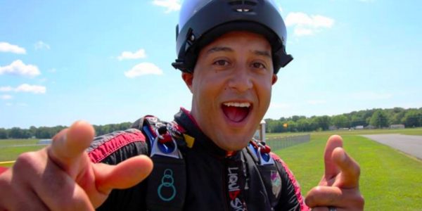 skydiver pointing at camera