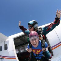 Tandem skydiving exit from plane