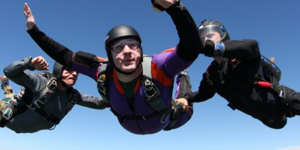 AFF student in freefall with 2 instructors