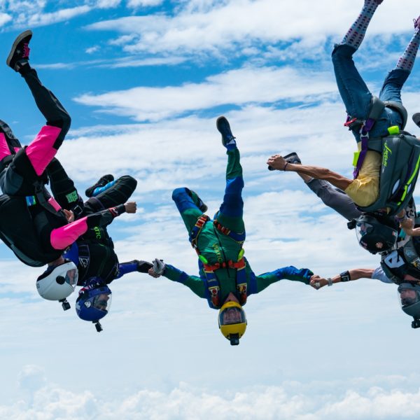 group of skydivers upsidedown