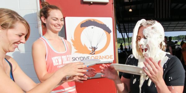 girls honor skydiving tradition of pie in the face