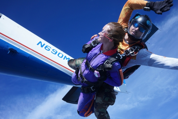 woman closes her eyes in skydiving freefall