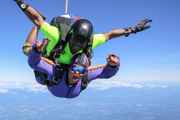 tandem skydiving student in freefall