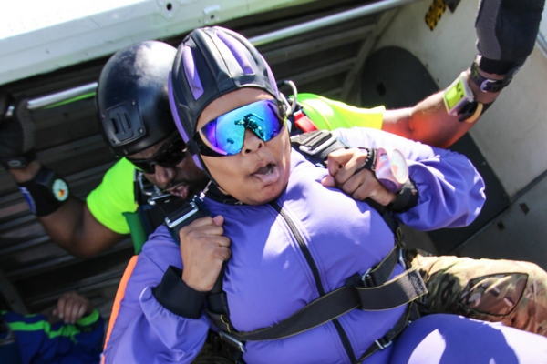 tandem skydiving student about to exit plane