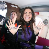 skydiving student with message on hands