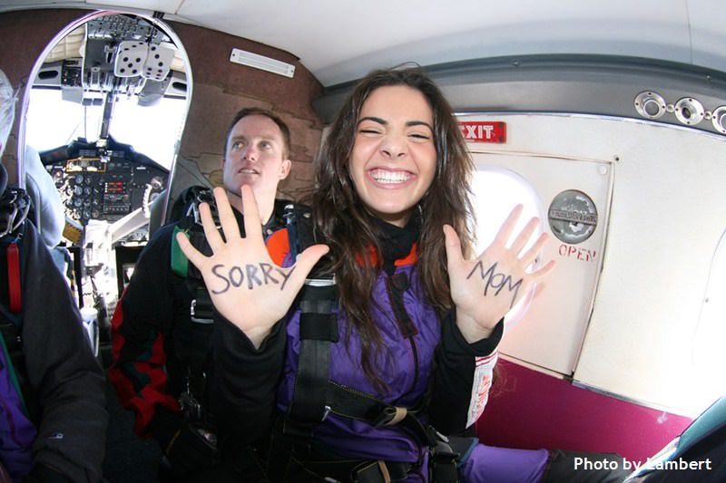 skydiving student with message on hands