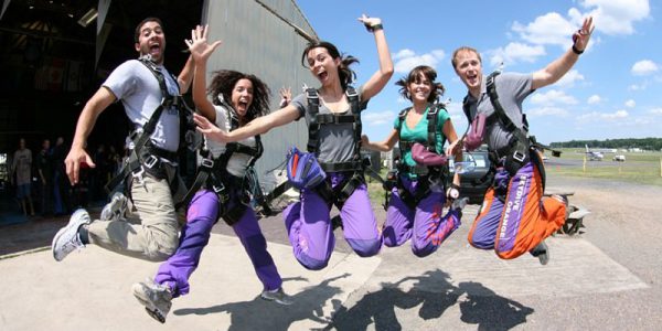 tandem skydivers jumping skydive orange