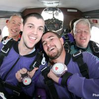 tandem skydiving students wearing altimeter