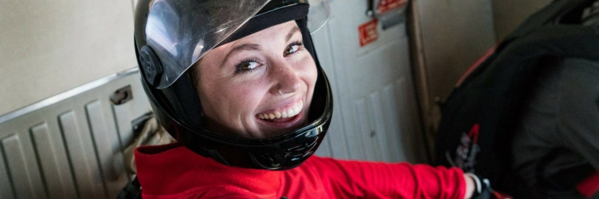 female skydiver gives a big smile